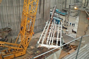 11 The preassembled structure of the grate is positioned