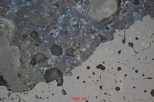 4 Microstructure of a magnesia-spinel brick (lower right) corroded by cement clinker (upper left). The periclase crystals resist infiltration and wear, which is limited to their surface. Pores (darker areas) are protected by the crystals, and not infiltrated, due to their closed nature