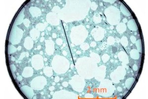 4 Computer tomography image; dark grey = solid base, light grey = pore; black = glass fibres