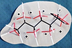 5 Glucose molecule adsorbed on ­positively charged cement sur­face (stable type of adsorption with several free electron pairs)/delimited surface (grey) corresponds to approx. 80 Å2