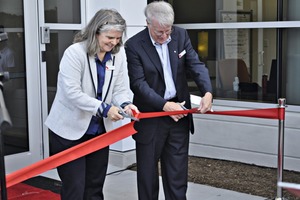 Angelika Huemer and J. Cranfort cutting the ribbon