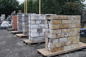 4(a) and (b) left, model walls under construction (a) prior to installation of wall crown, right, model wall during injection (b)