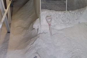 1 Piled high enough to encapsulate the tail pulley and belt, the dust was a serious problem