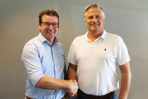 Handshake between the two Managing Directors of the newly founded company MC-Bauchemie Danmark ApS: Walter Devue (left) and Klaus Lebæk (right)