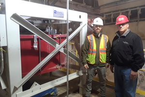Matthew Thompson and Kenny Miller in front of the Pfister rotor weighfeeder