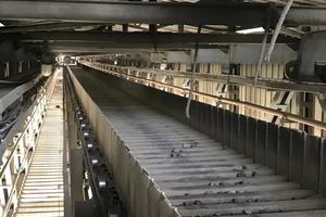 Deep pan conveyor below cooler