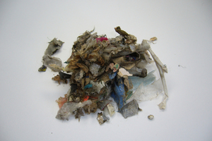 3 Secondary fuels a) prior to grinding and b) after grinding (0.5 mm sieve)