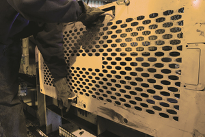 3 Distinctive orange safety grates from Martin Engineering are prominent throughout many safety-minded organizations