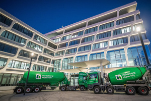 Silo train and concrete truck mixer in the new design in front of the headquarters in Heidelberg