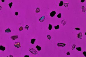 11 Mixture of granulated EAF slag No. 5 (black grains) and granulated blast furnace slag (coloured and transparent); transmitting light microscope, crushed fraction         40-63 µm
