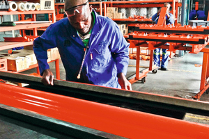 3 A worker inspects a freshly molded belt cleaner blade at the Martin Engineering facility in South Africa
